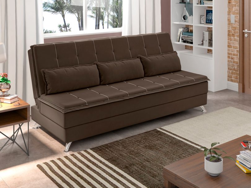 Uma sala com um sofá-cama marrom. Sofá-cama.