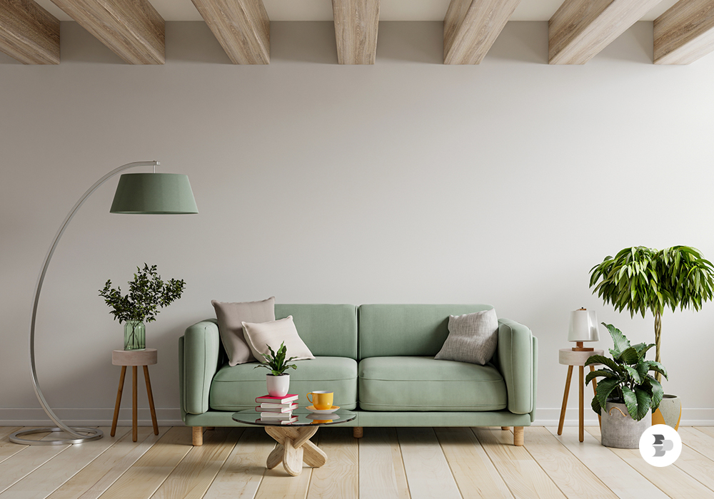 Uma sala ambientada com o sofá nas mesmas cores de outros itens decorativos. Escolher sofá.