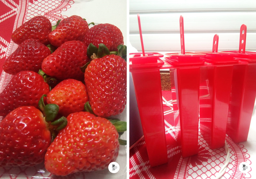 Uma imagem com morangos e forma de picolés. Receita picolé caseiro.